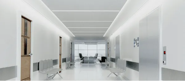 Couloir moderne et lumineux avec ascenseurs et portes.